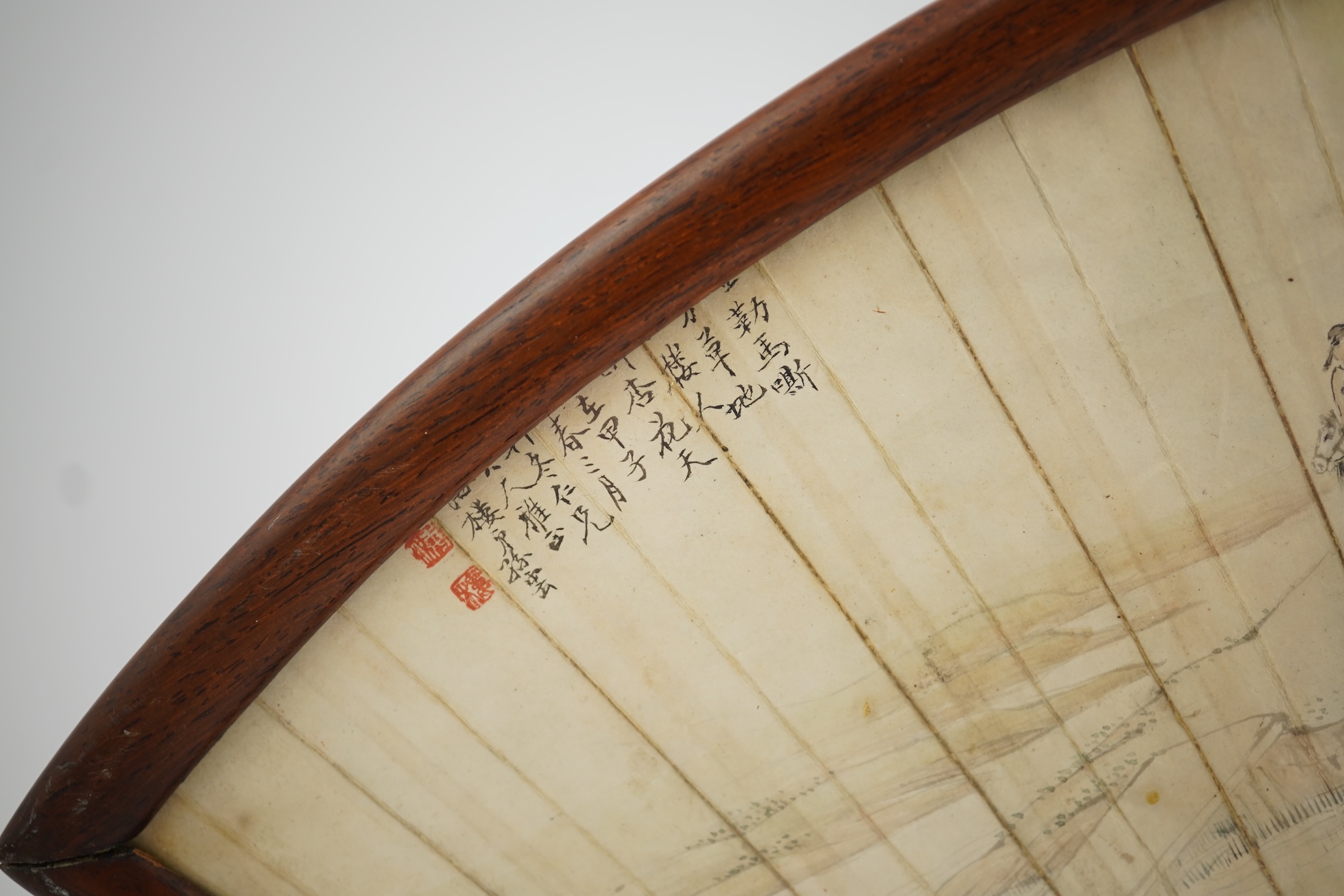 A Chinese painted leaf fan and hardwood stand, late 19th century